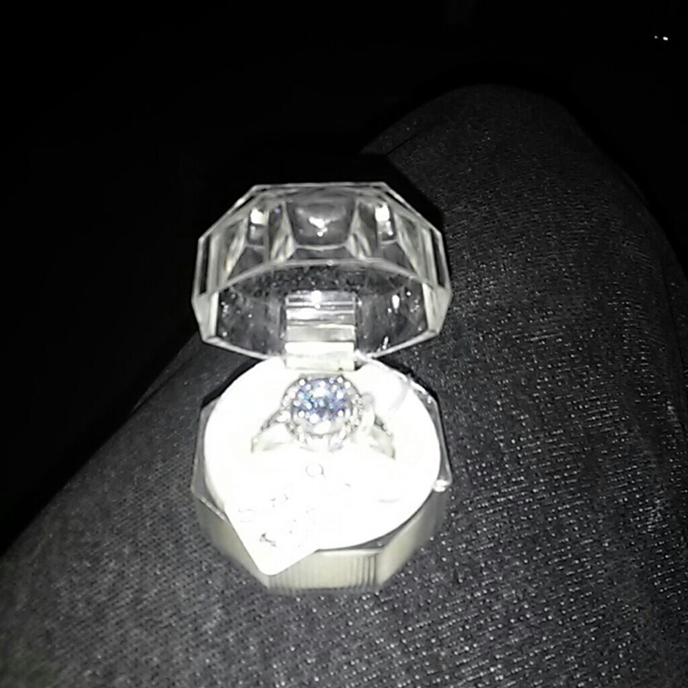 Women's silver engagement, or promise ring.
